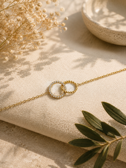 ENA - Golden bracelet with intertwined rings and zirconias